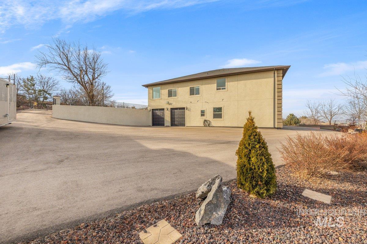 5990 West View Drive Meridian, ID 83642 - Photo 40 of 50 View of side of property featuring stucco siding