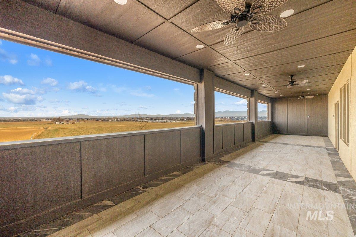 5990 West View Drive Meridian, ID 83642 - Photo 48 of 50 View of patio featuring ceiling fan and a mountain view