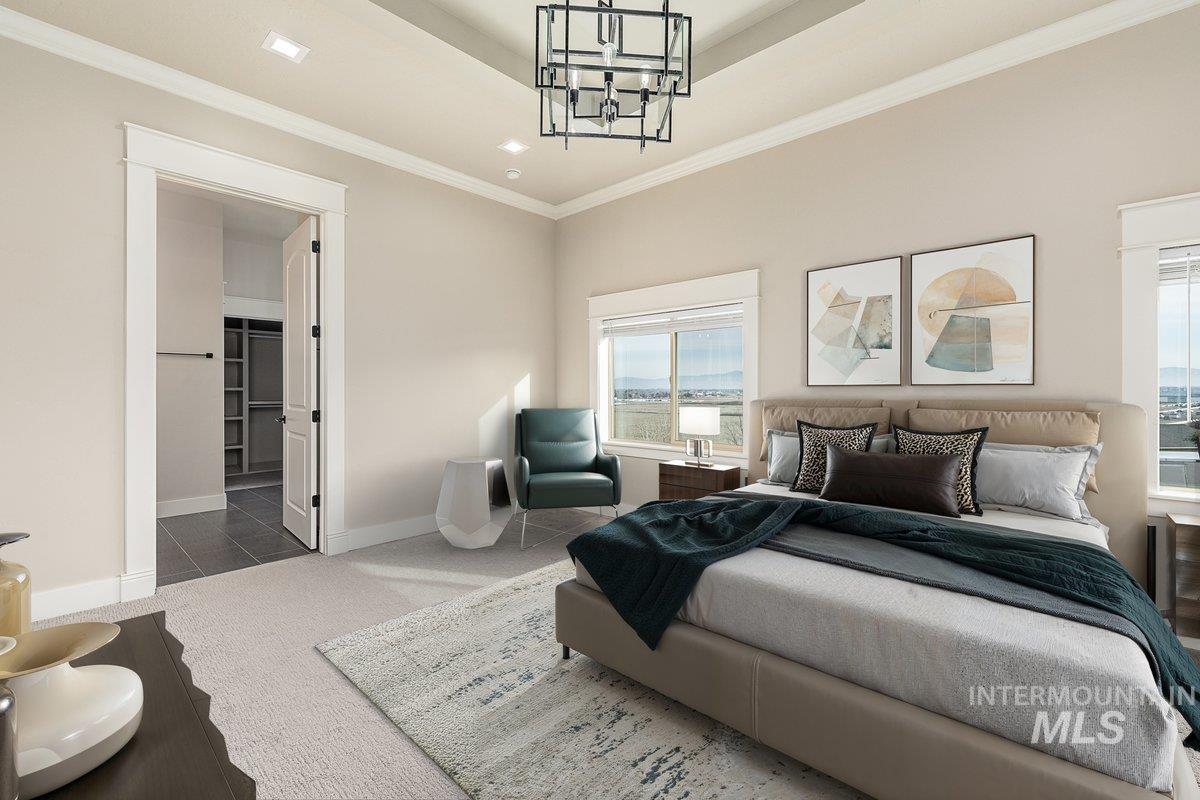 5990 West View Drive Meridian, ID 83642 - Photo 7 of 50 Bedroom with carpet, crown molding, a chandelier, ensuite bathroom, and a raised ceiling