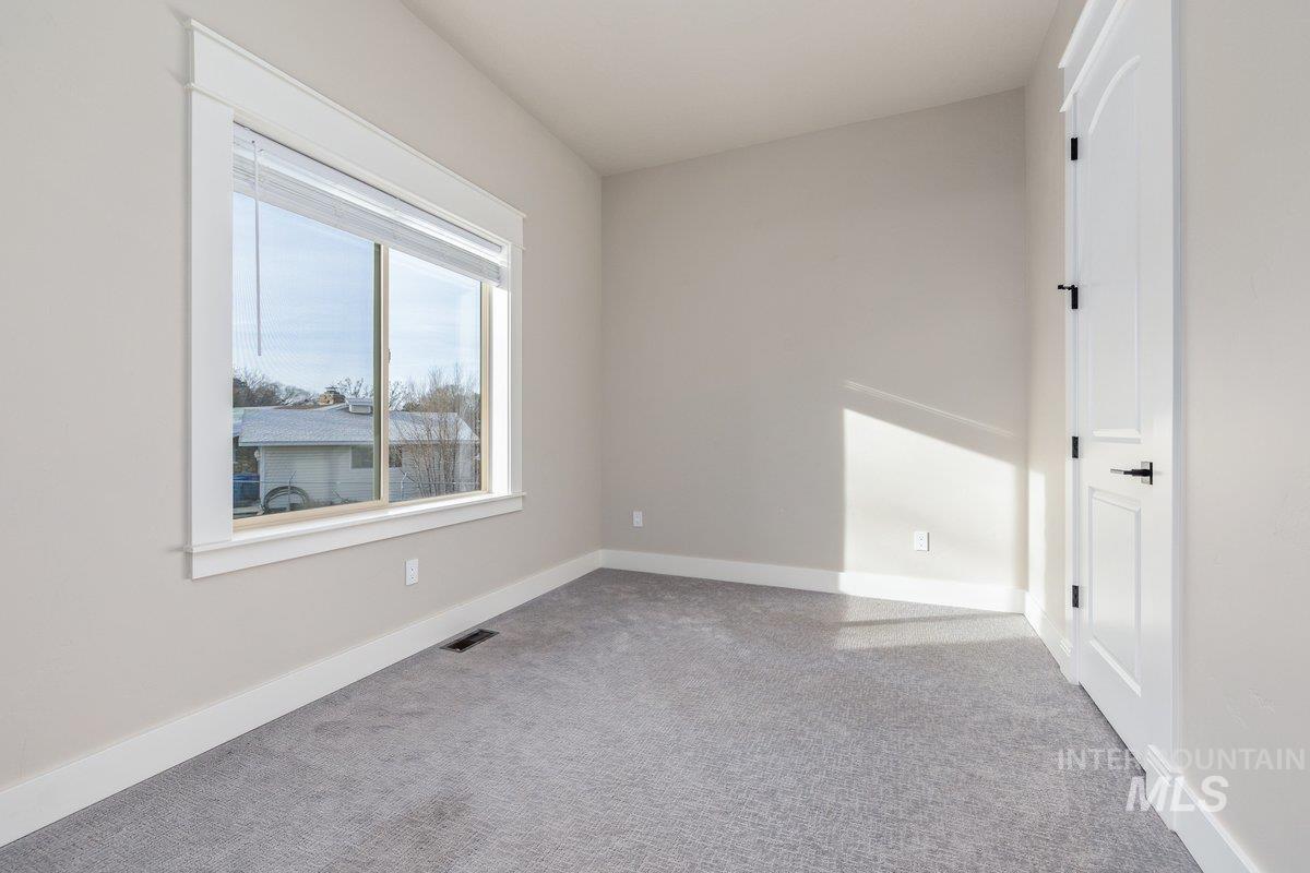 5990 West View Drive Meridian, ID 83642 - Photo 9 of 50 Spare room with light carpet and baseboards