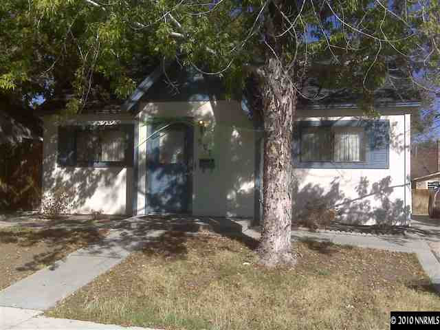 a view of a house with large tree