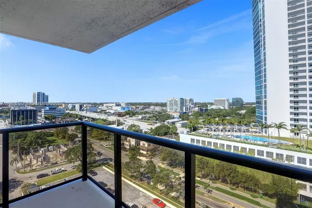 a kitchen with stainless steel appliances granite countertop a refrigerator and a stove