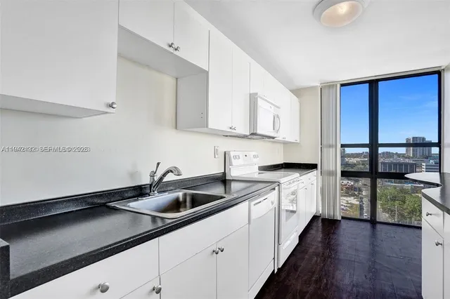 a kitchen with a sink and cabinets