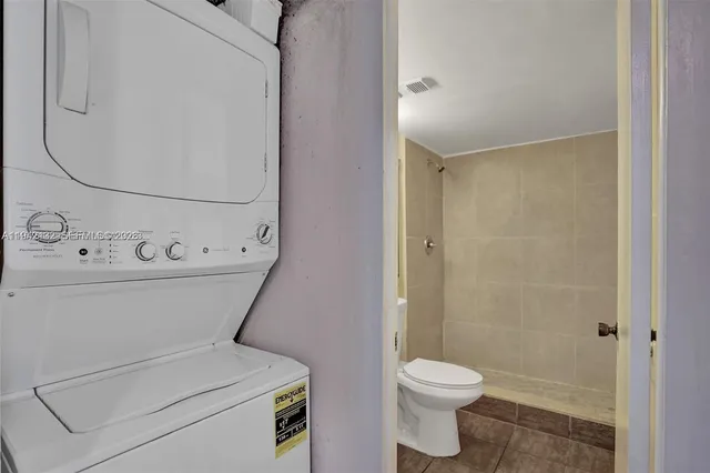 a view of a house with a yard and ocean view