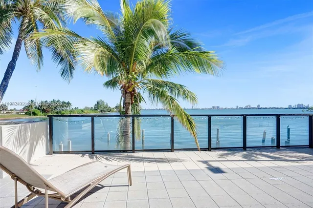 a view of a swimming pool with a porch