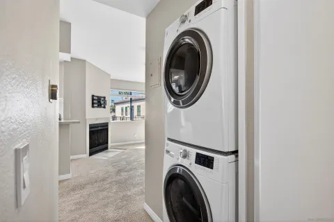 a view of a kitchen with washer and dryer