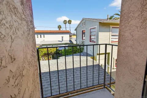 a view of a balcony with a floor to ceiling window