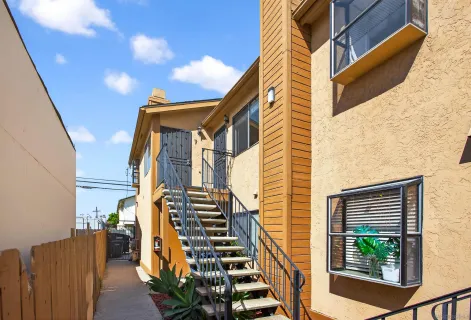 a view of balcony with wooden floor and fence