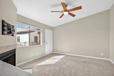 a very nice looking room with a ceiling fan