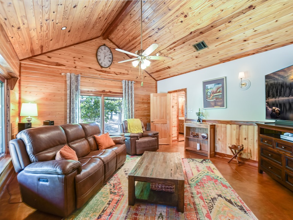254 Middleton Road Spicewood, TX 78669 - Photo 11 of 32 a living room with furniture and a large window