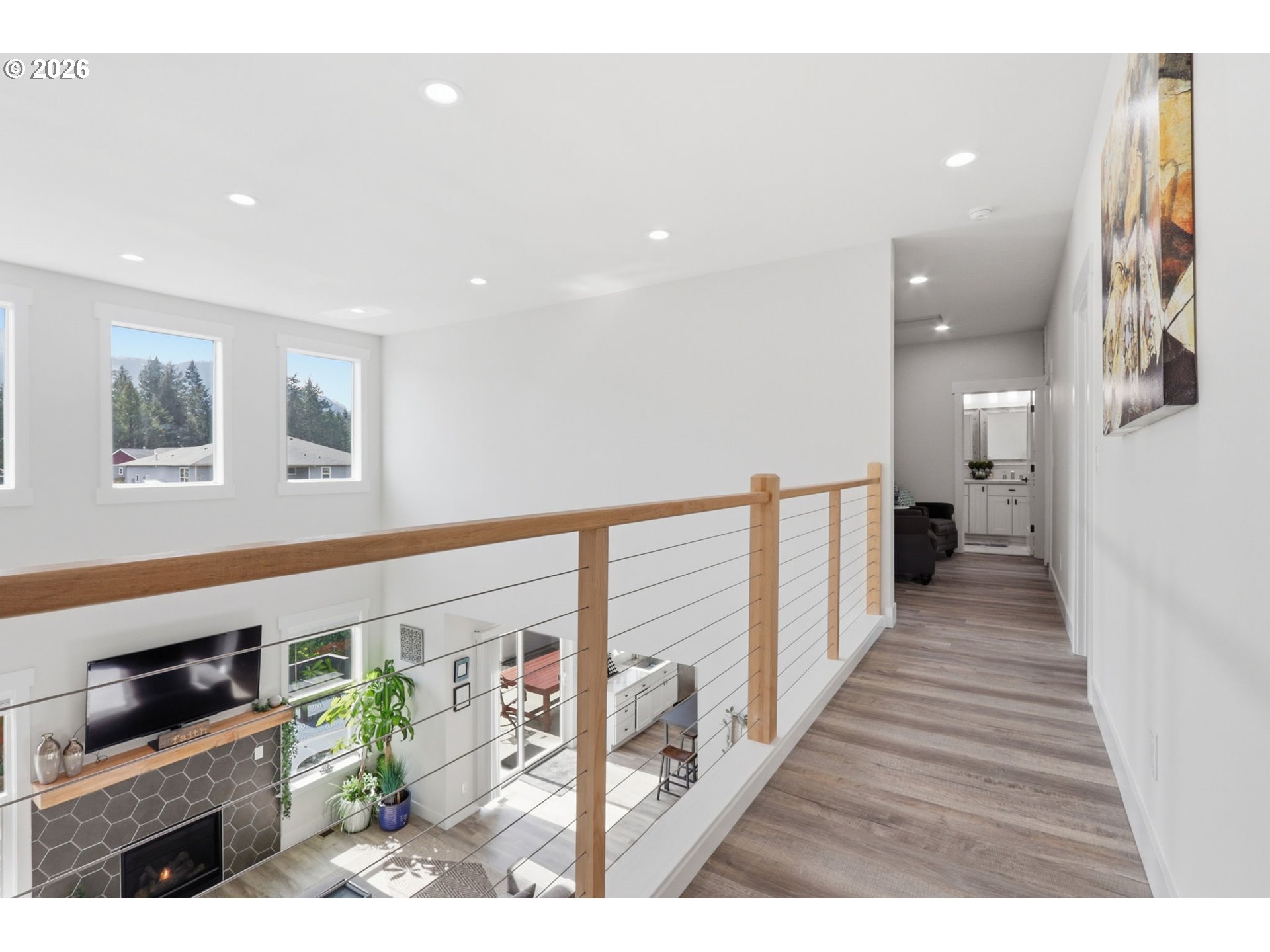 1226 Northwest Iman Loop Road Stevenson, WA 98648 - Photo 20 of 39 a view of a hallway with wooden floor and staircase