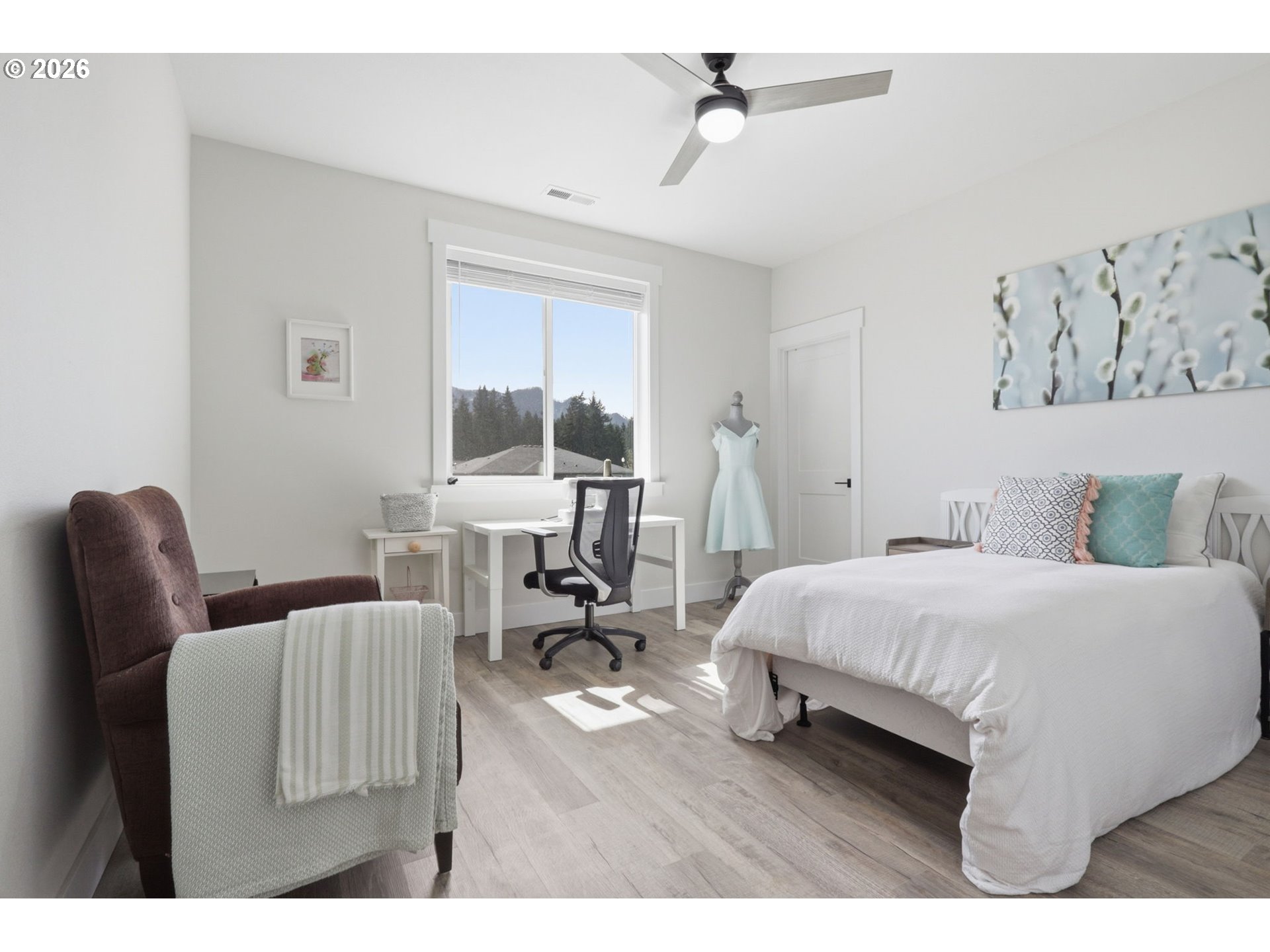 1226 Northwest Iman Loop Road Stevenson, WA 98648 - Photo 24 of 39 a bedroom with a bed a table and chair