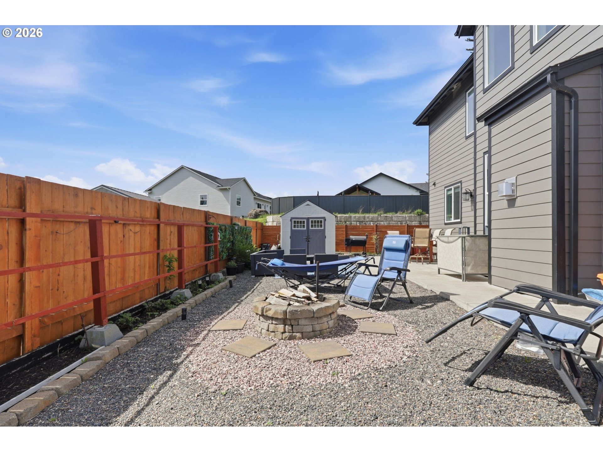1226 Northwest Iman Loop Road Stevenson, WA 98648 - Photo 28 of 39 a view of a patio with table and chairs with wooden floor