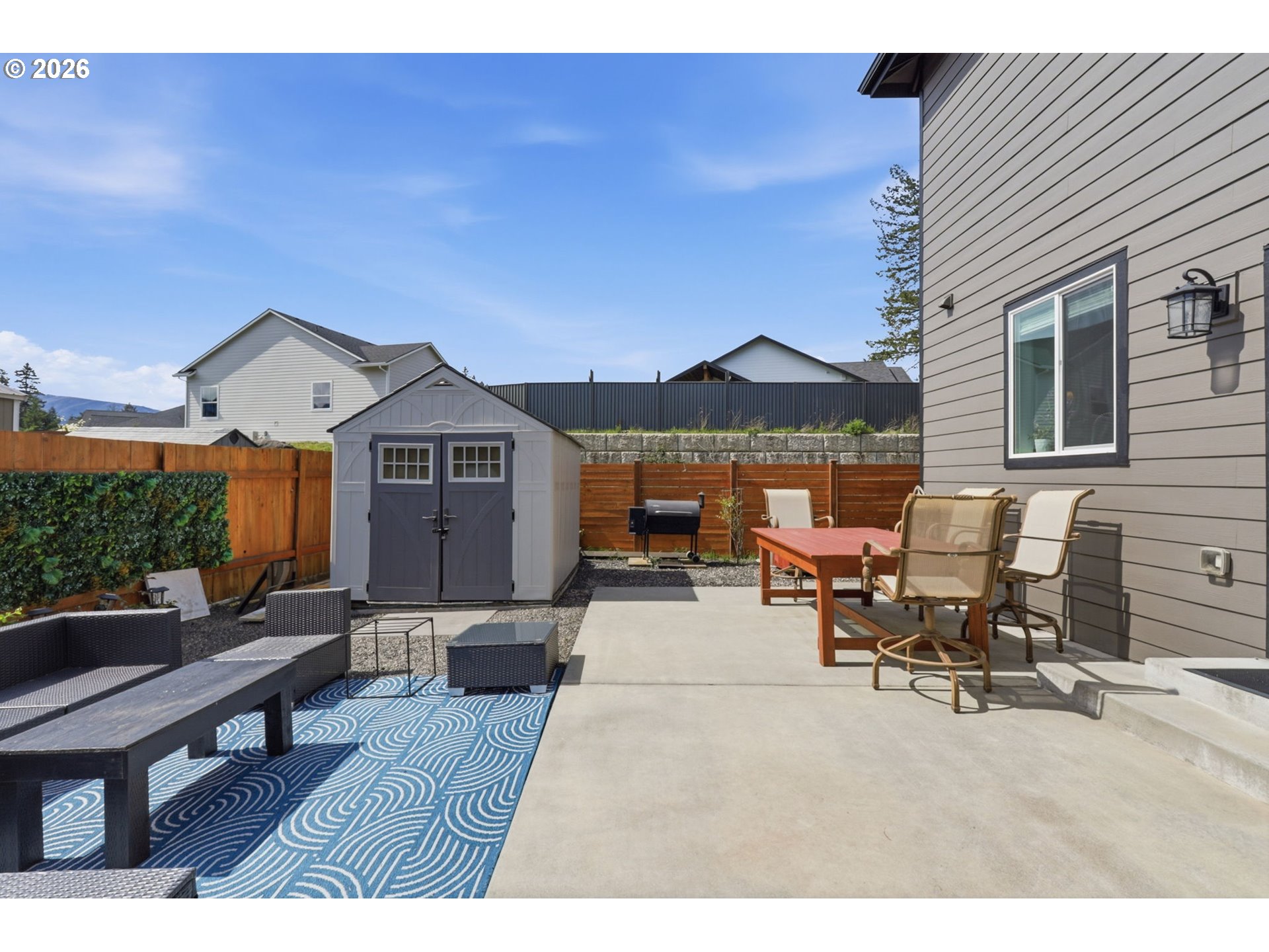 1226 Northwest Iman Loop Road Stevenson, WA 98648 - Photo 29 of 39 a view of a patio with a table and chairs