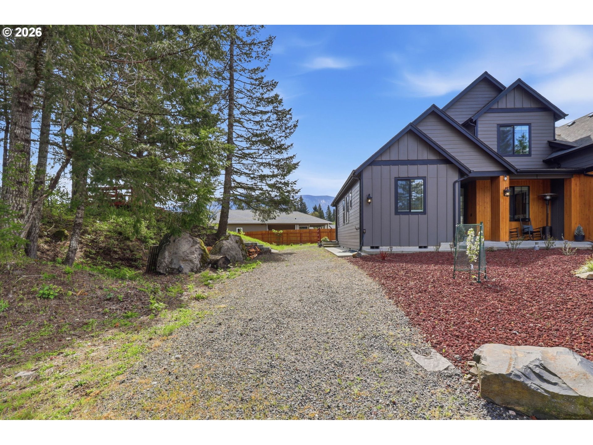 1226 Northwest Iman Loop Road Stevenson, WA 98648 - Photo 32 of 39 a front view of a house with a yard