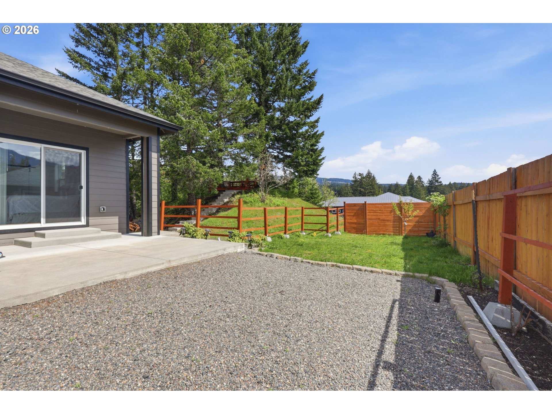 1226 Northwest Iman Loop Road Stevenson, WA 98648 - Photo 33 of 39 a view of a house with a yard
