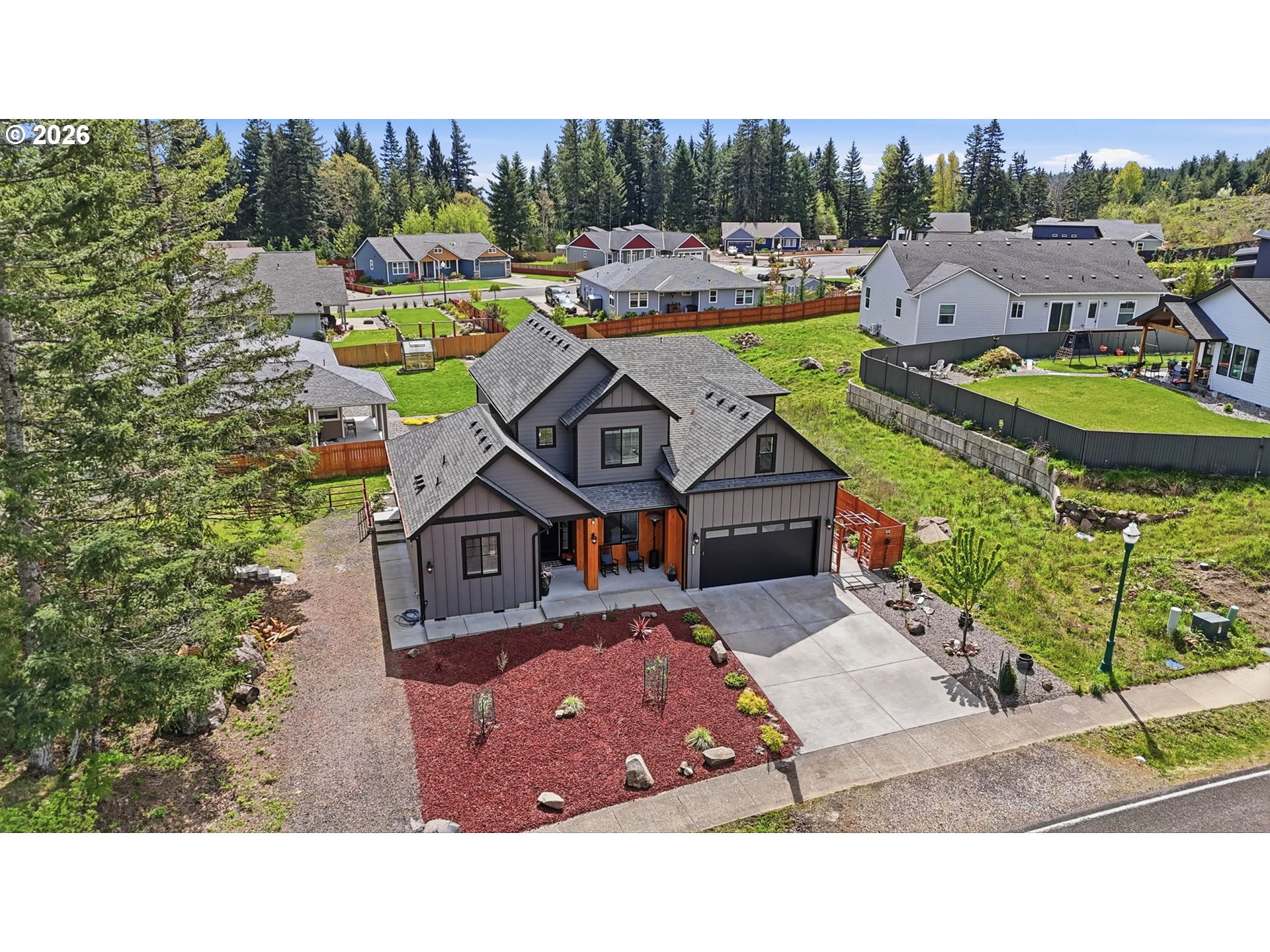 1226 Northwest Iman Loop Road Stevenson, WA 98648 - Photo 36 of 39 an aerial view of a house with a swimming pool outdoor seating and yard