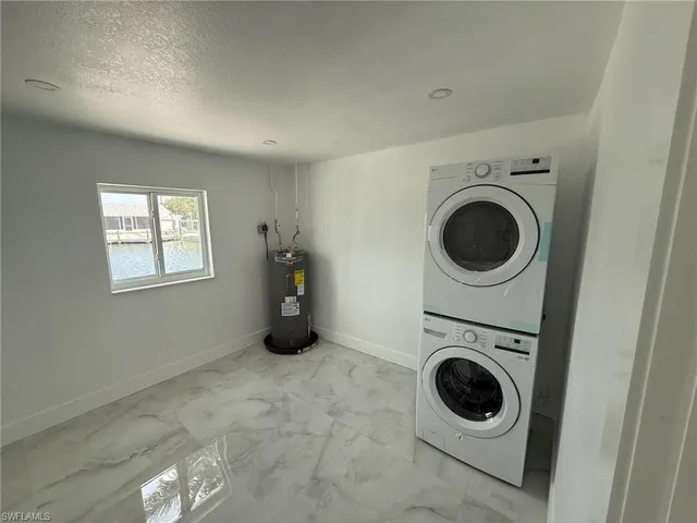 a view of a storage & utility room with a washer and dryer