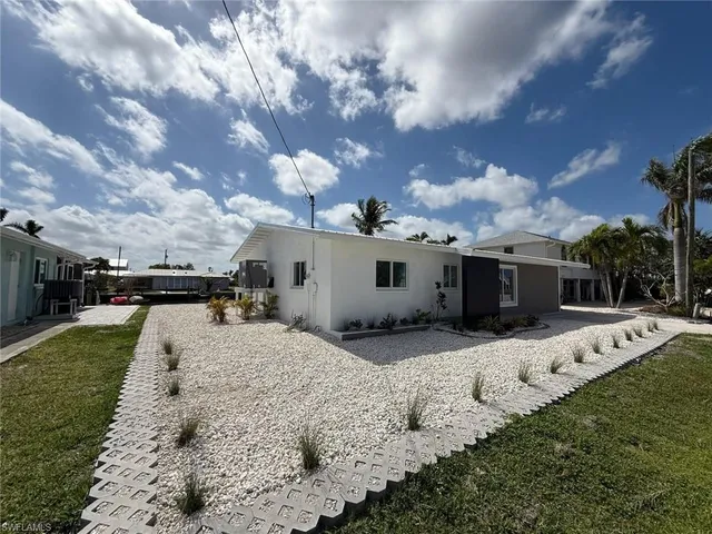 a view of a backyard of the house