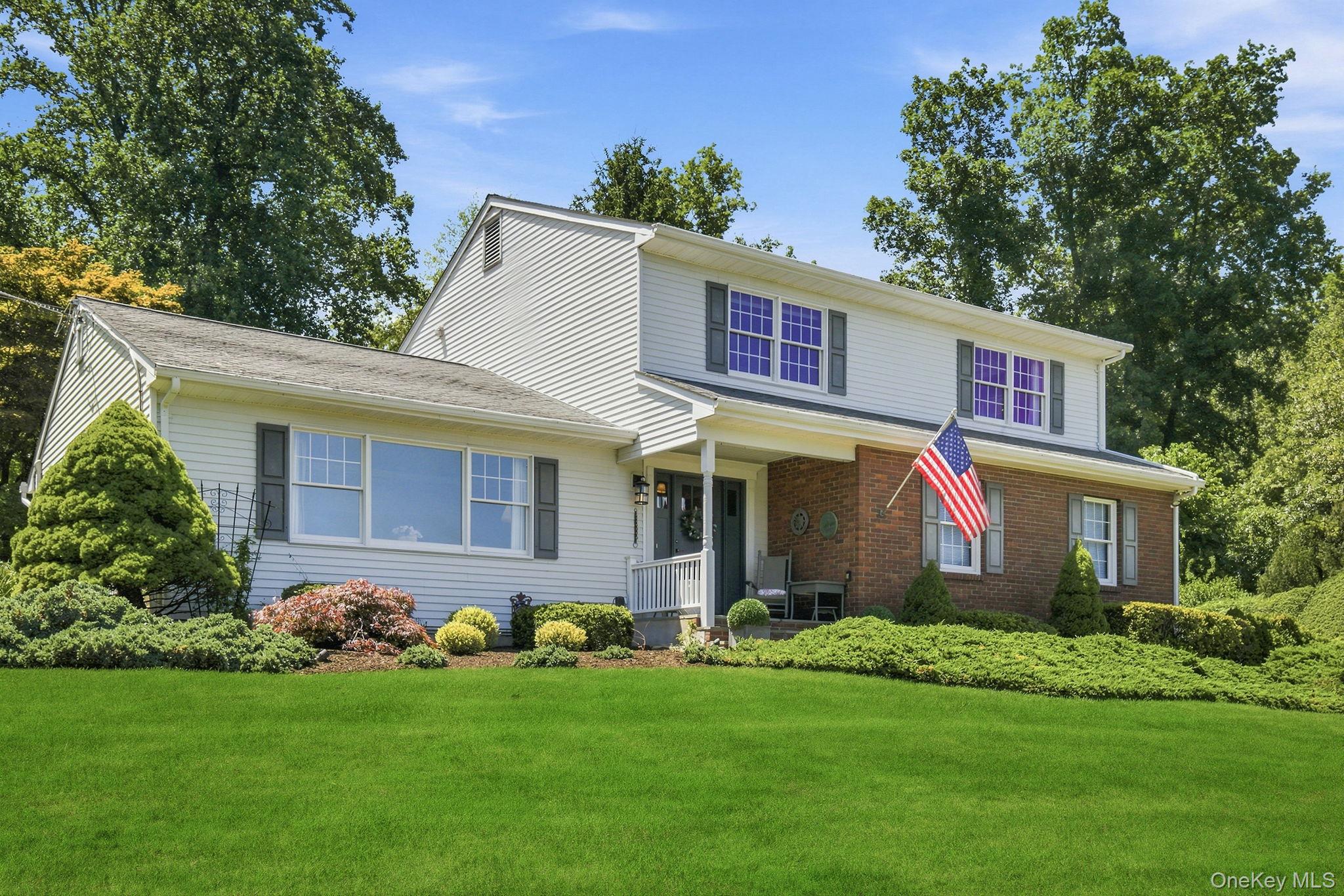 32 Bedell Road Katonah, NY 10536 - Photo 42 of 49 A crisp white and brick facade gives this Colonial timeless curb appeal.