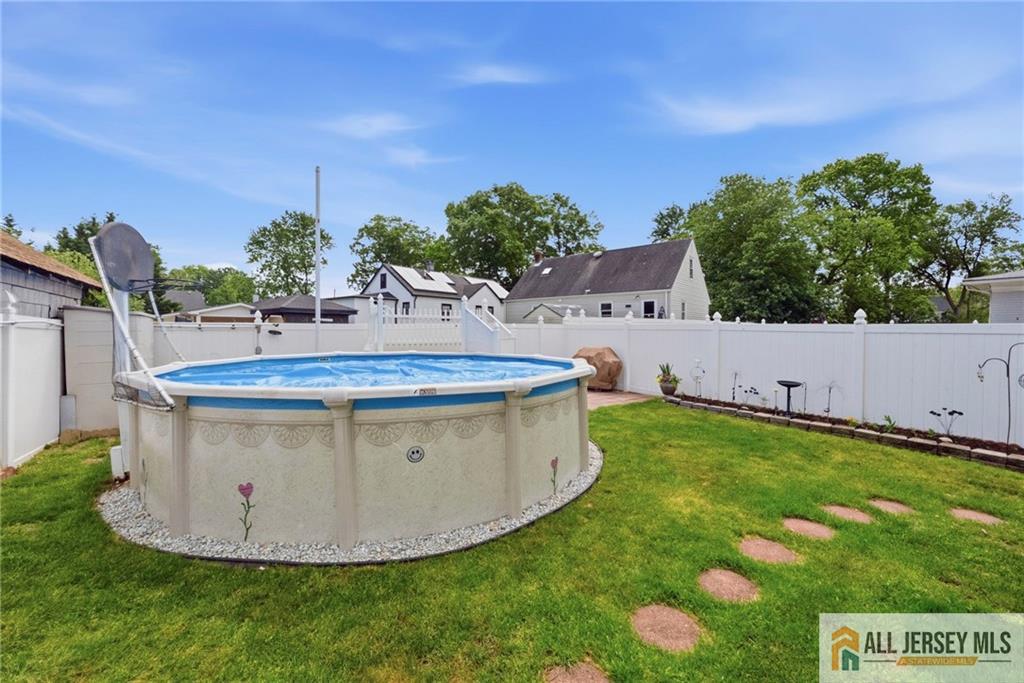 50 3rd Street Fords, NJ 08863 - Photo 33 of 36 a view of a swimming pool with an outdoor space and seating area
