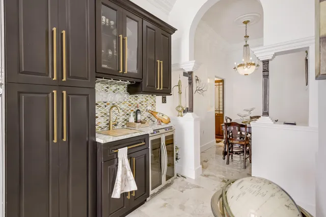 a white toilet sitting next to a bathroom sink