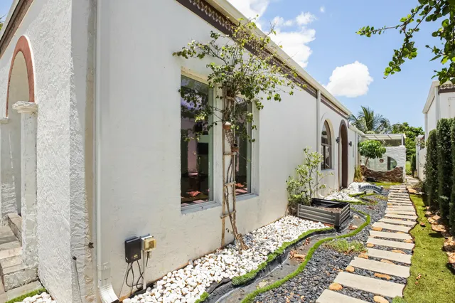 a view of a kitchen center island cabinets and stainless steel appliances
