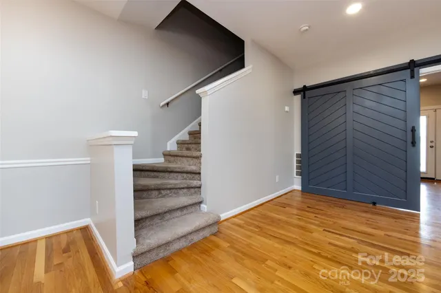 a view of entryway with wooden floor