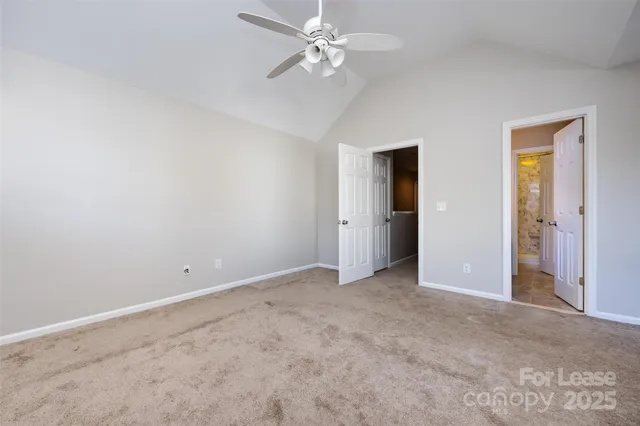an empty room with fan and a ceiling fan