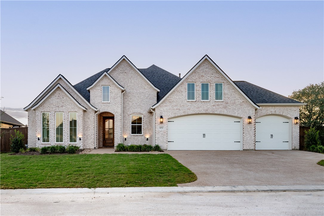 4752 Coral River Road College Station, TX 77845 - Photo 1 of 1 a view of a house with a yard and garage