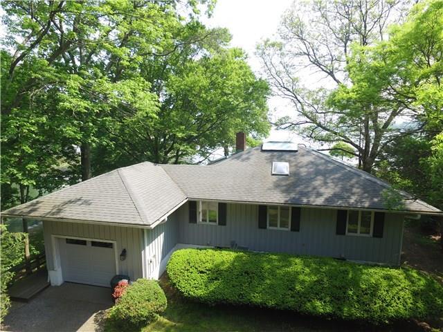 10 Seagate Road Darien, CT 06820 - Photo 1 of 1 a front view of a house with a garden