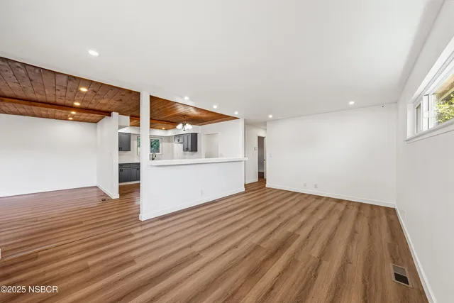 a view of a livingroom with wooden floor