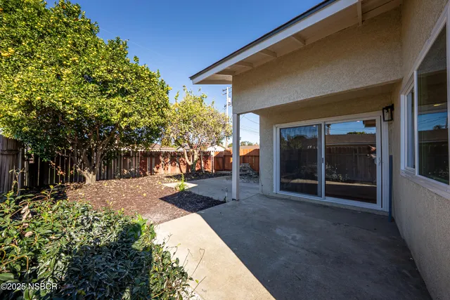 a view of a backyard with sitting area