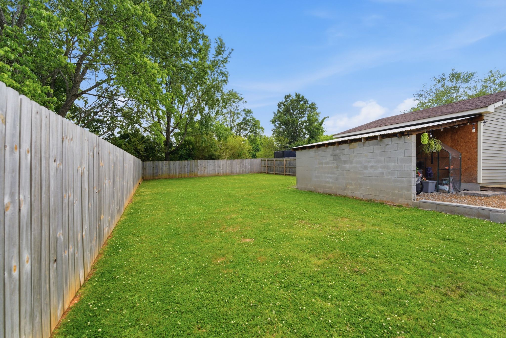 3106 Cimarron Trail Murfreesboro, TN 37129 - Photo 27 of 33 a view of a backyard with potted plants and wooden fence