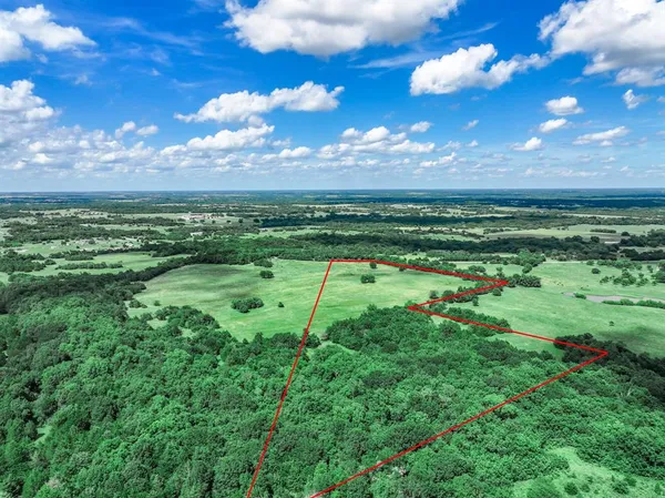 a view of a golf course with a lake