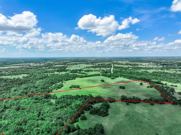 a view of a golf course with green space