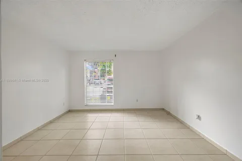 an empty room with a empty space and a window