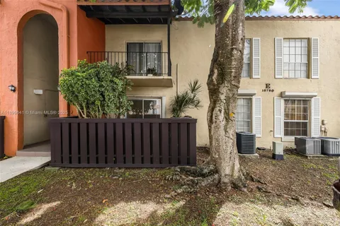 a view of a street with a building in the background