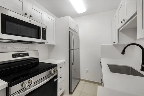 a kitchen with a stove and a microwave