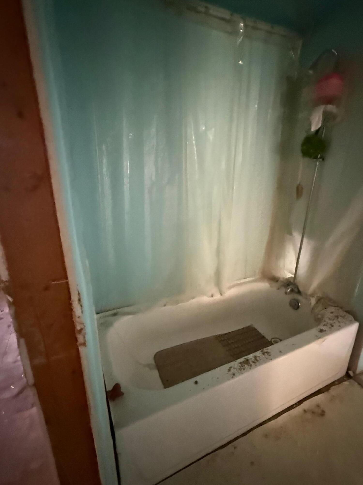725 Minnie Street Michigan City, IN 46360 - Photo 6 of 12 a bathroom with a bathtub