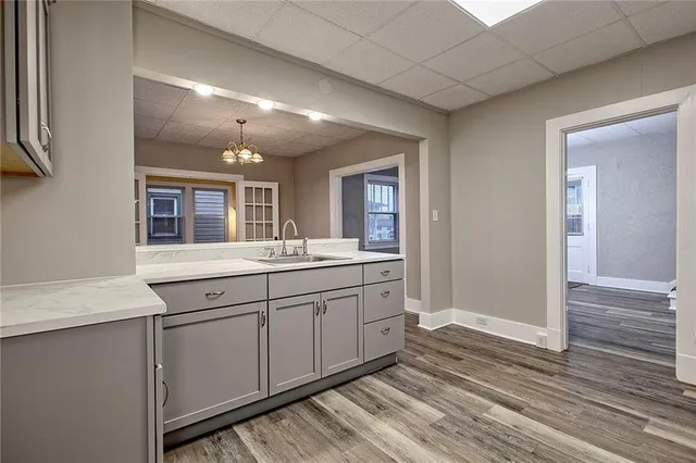 a spacious bathroom with a double vanity sink and a mirror