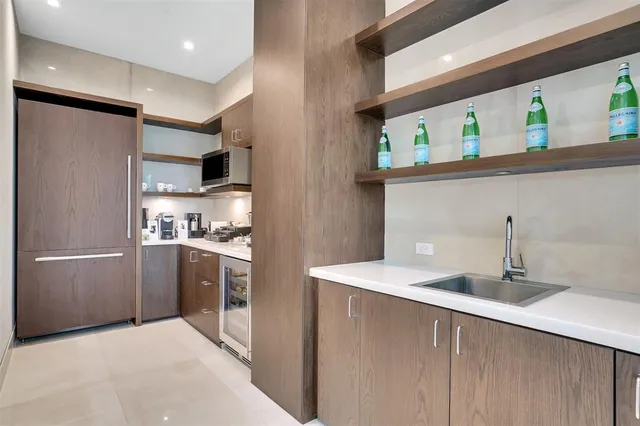 a kitchen with a stove and a refrigerator