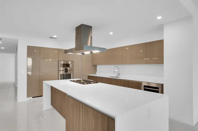 a kitchen with a stove and a refrigerator