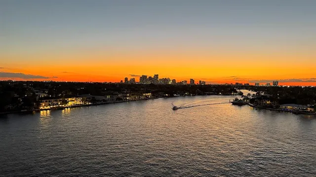 a view of a water with tall buildings
