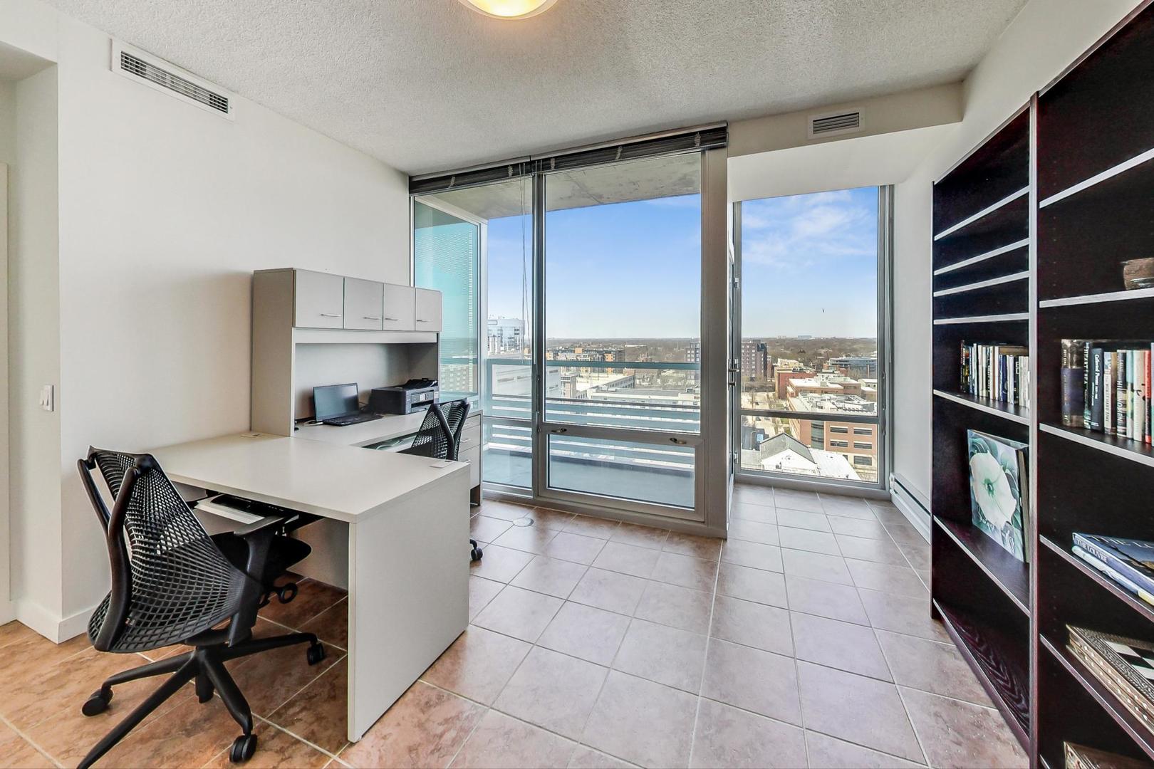 800 Elgin Road, Unit PH02 Evanston, IL 60201 - Photo 18 of 43 a kitchen with a stove a refrigerator and a view of cabinets