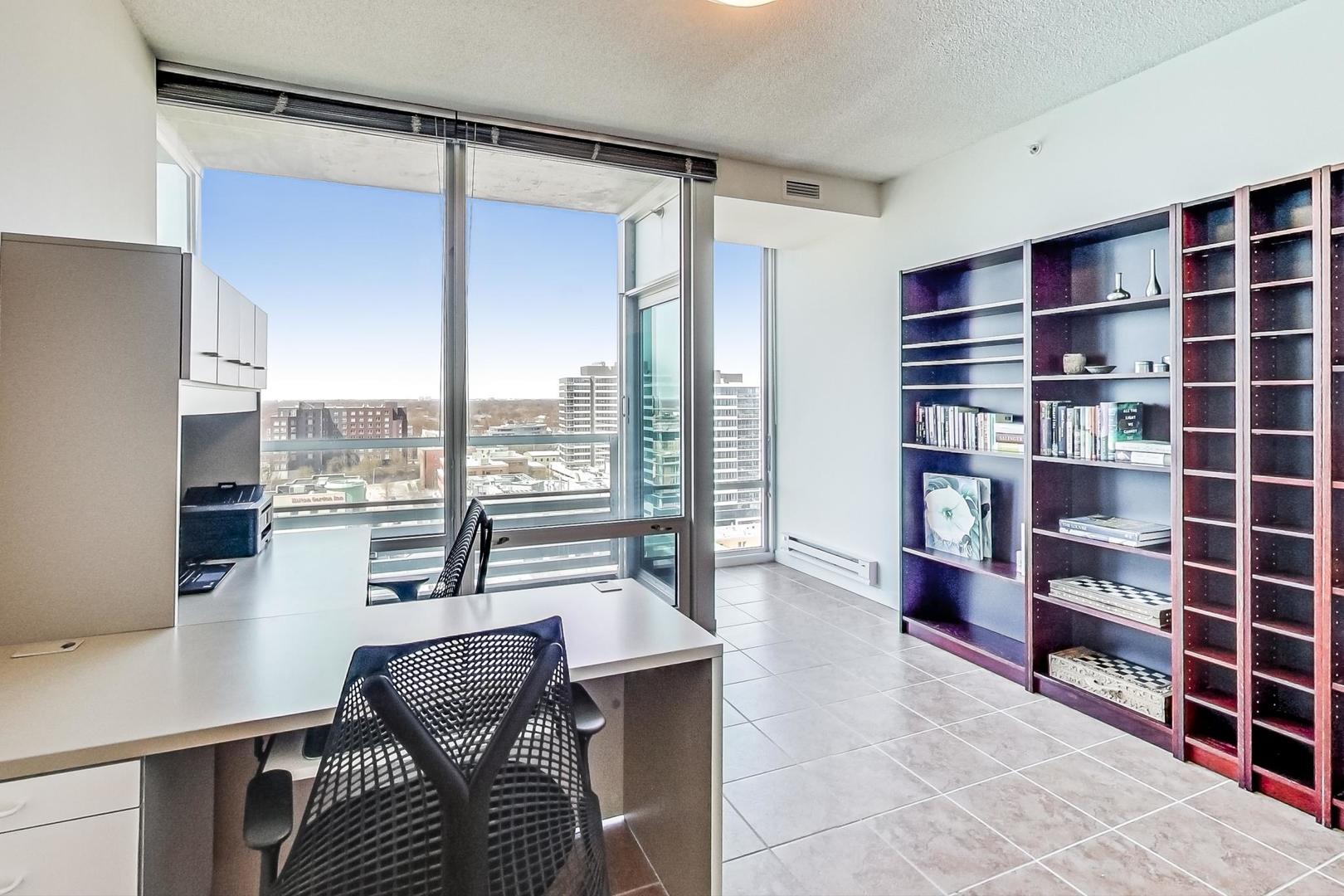 800 Elgin Road, Unit PH02 Evanston, IL 60201 - Photo 19 of 43 a living room with furniture and a floor to ceiling window