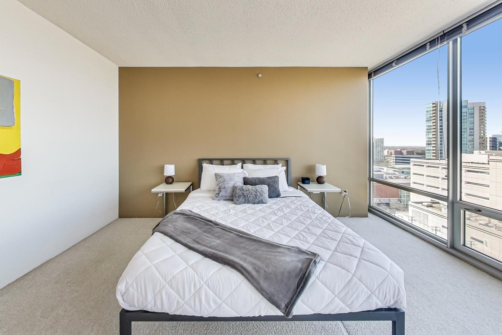 800 Elgin Road, Unit PH02 Evanston, IL 60201 - Photo 25 of 43 a bedroom with a bed and window