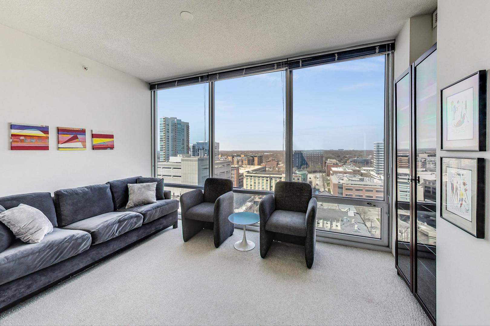 800 Elgin Road, Unit PH02 Evanston, IL 60201 - Photo 29 of 43 a living room with furniture and a large window