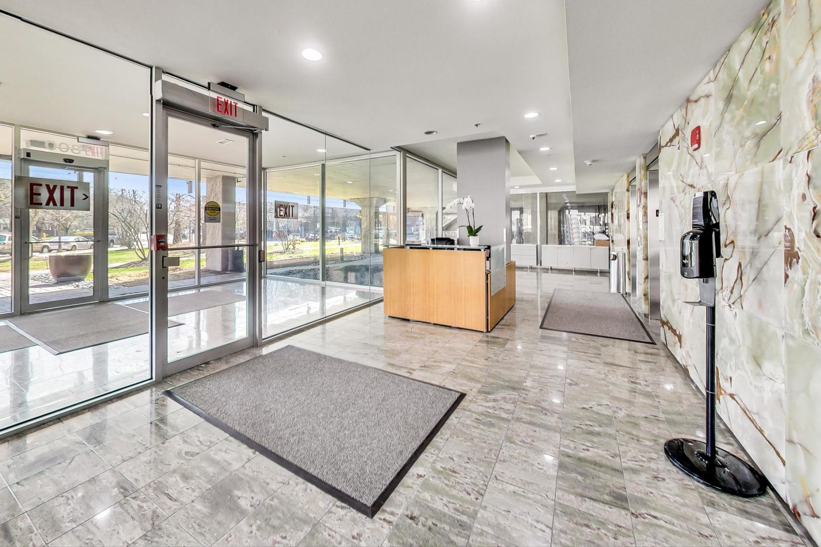 800 Elgin Road, Unit PH02 Evanston, IL 60201 - Photo 3 of 43 a view of living room with furniture and floor to ceiling window