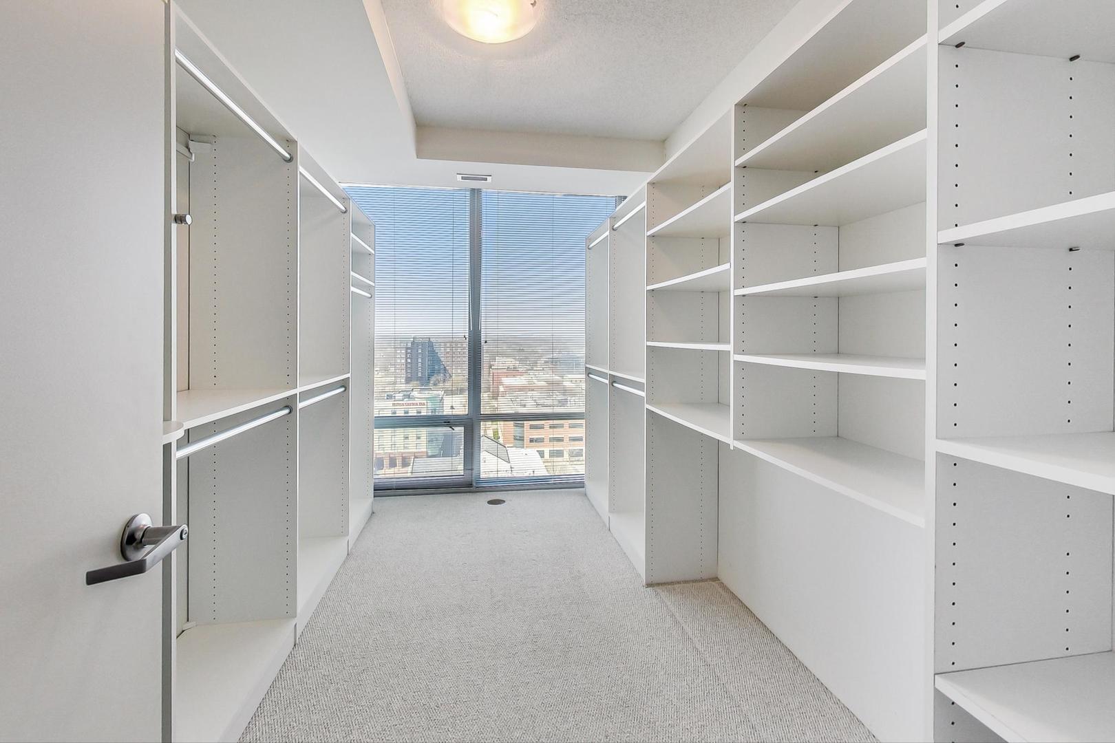 800 Elgin Road, Unit PH02 Evanston, IL 60201 - Photo 32 of 43 a view of an empty walk in closet